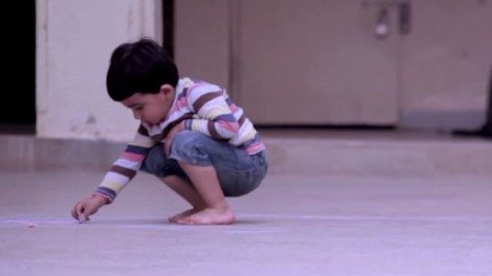 Boy-drawing-on-the-pavement-but-if-you-see-his-work-you-will-not-be-able-to-hold-back-the-tears